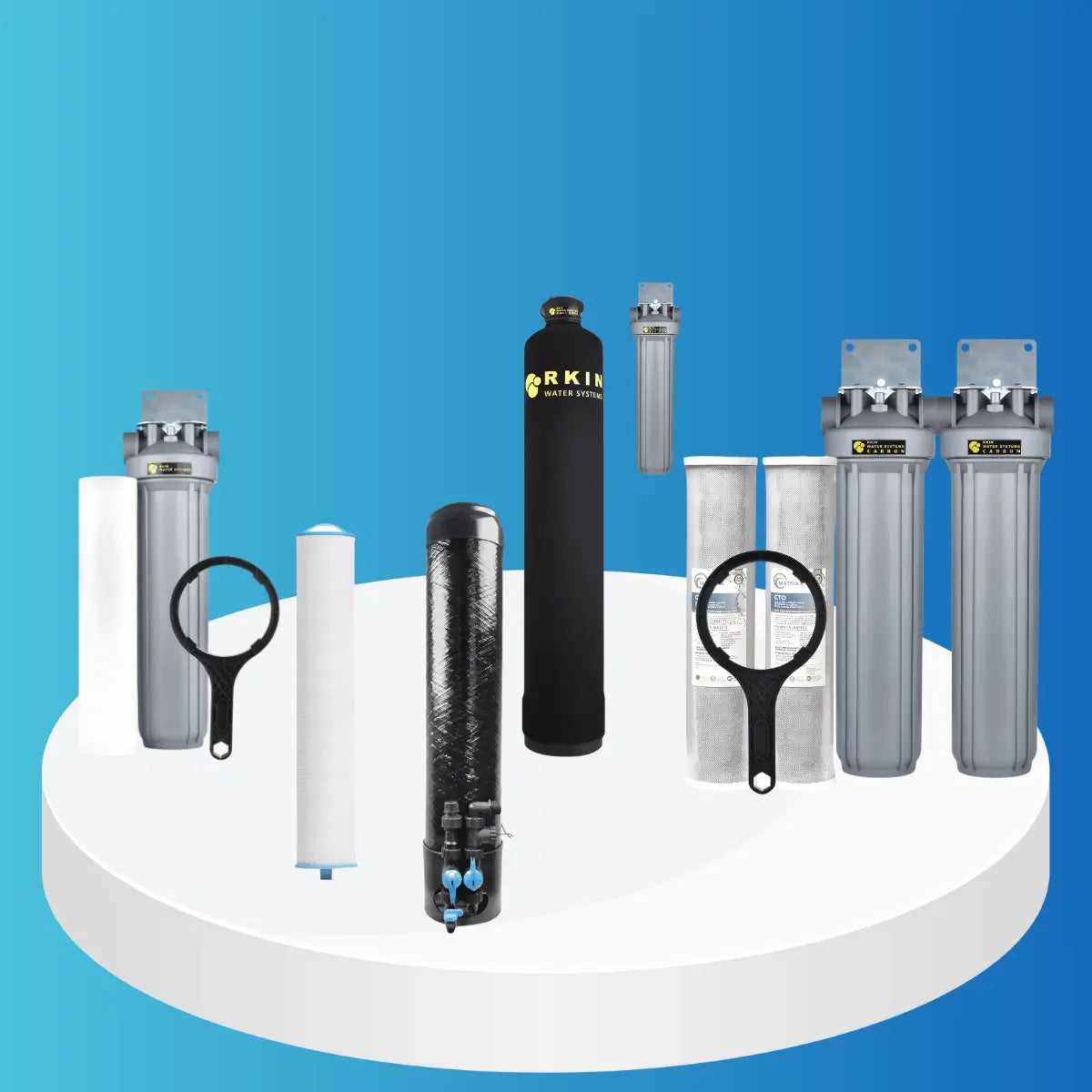 RKIN Whole House Filters collection featuring mineral tanks, multi-stage filter housings, sediment and carbon cartridges, and filter wrenches displayed on a white platform with blue background.