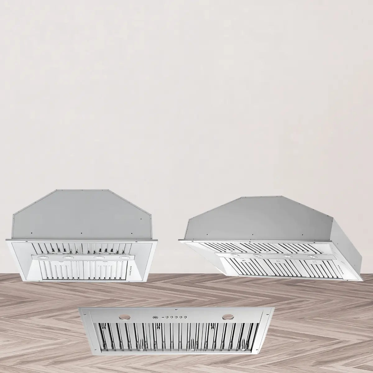 Range hood inserts collection featuring stainless steel built-in kitchen ventilation inserts with baffle filters, integrated lighting, and compact under-cabinet design for custom installations.